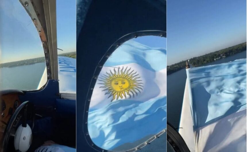 homenaje-en-el-cielo-de-posadas:-un-piloto-sobrevolo-la-costanera-con-una-bandera-argentina-en-honor-a-los-heroes-de-malvinas